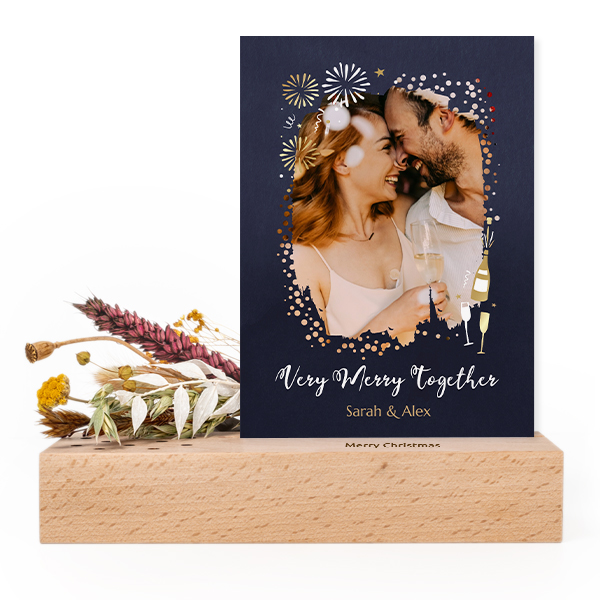 Wooden block with print, dried flowers and forex card