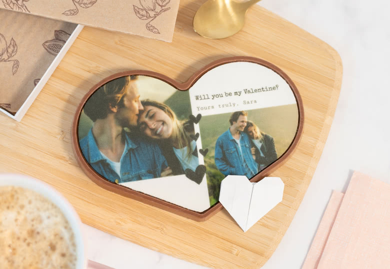 Heart-shaped chocolate with personalised photo of a couple and Valentine