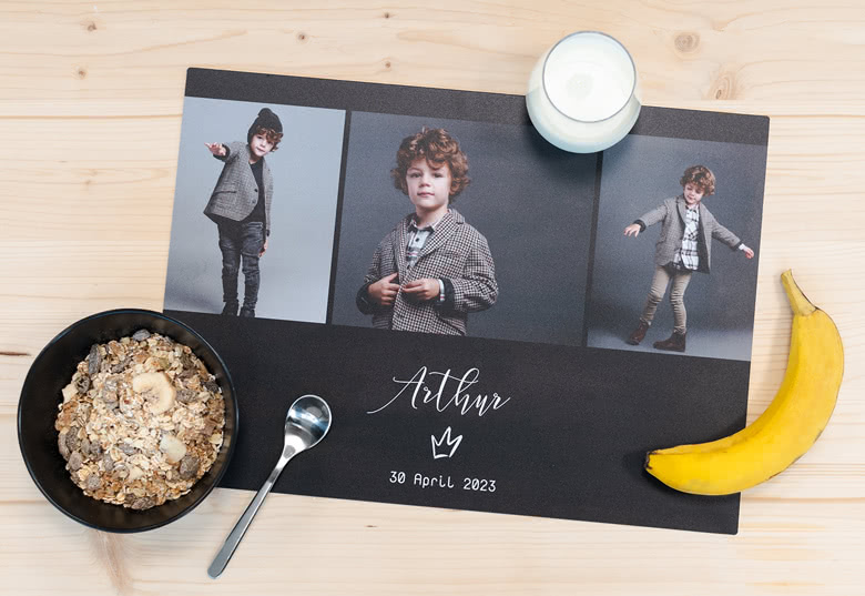 Customised black placemat with three photo panels and white text 